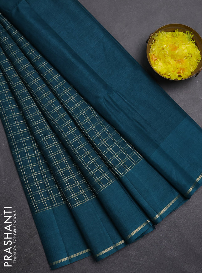 Semi tussar saree peacock green with allover zari checks and simple zari woven border