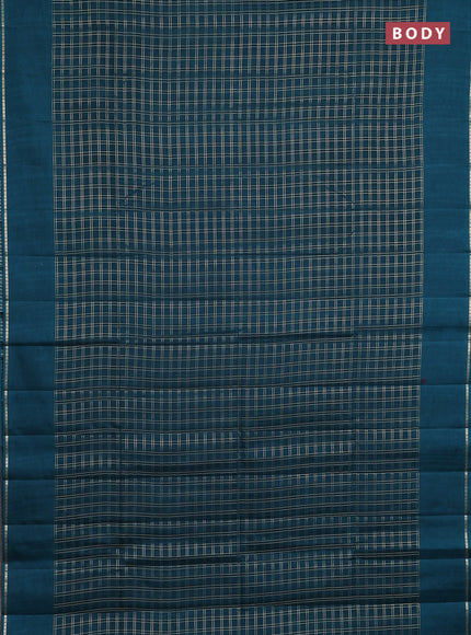 Semi tussar saree peacock green with allover zari checks and simple zari woven border