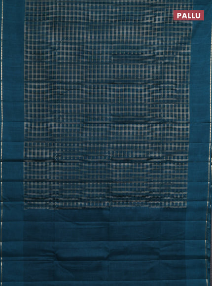 Semi tussar saree peacock green with allover zari checks and simple zari woven border