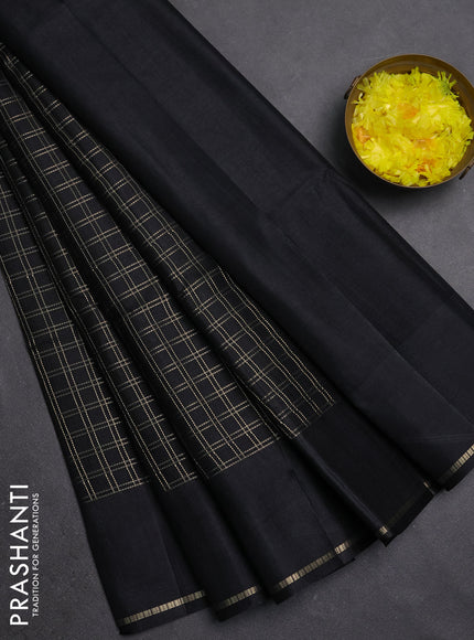 Semi tussar saree black with allover zari checks and simple zari woven border