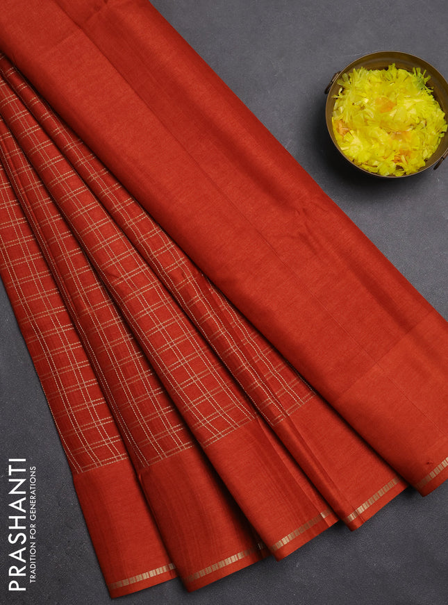 Semi tussar saree rust with allover zari checks and simple zari woven border