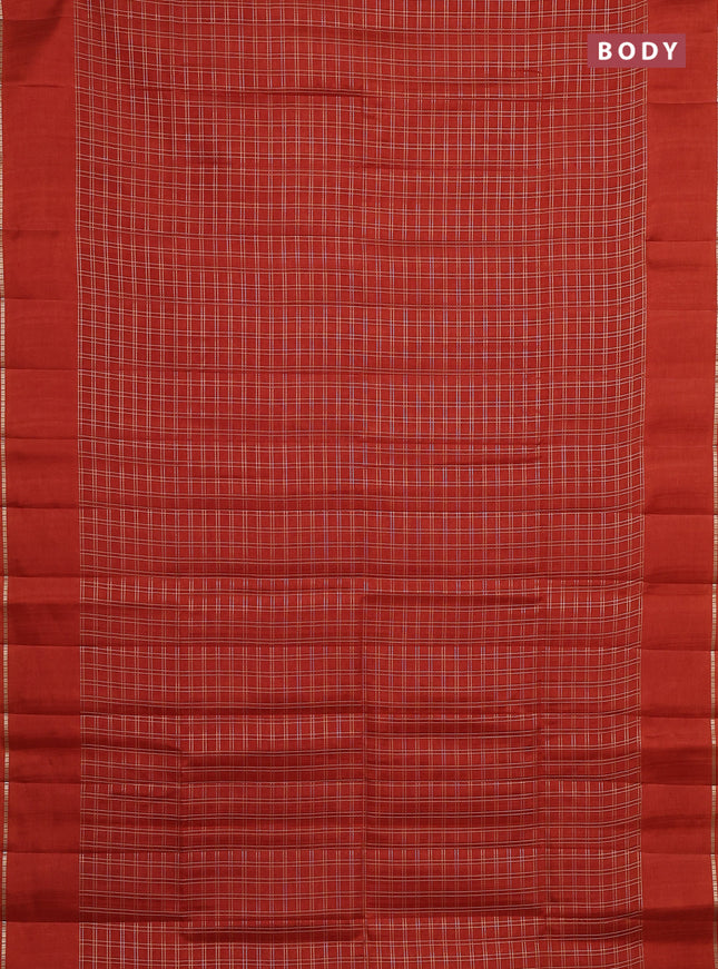 Semi tussar saree rust with allover zari checks and simple zari woven border