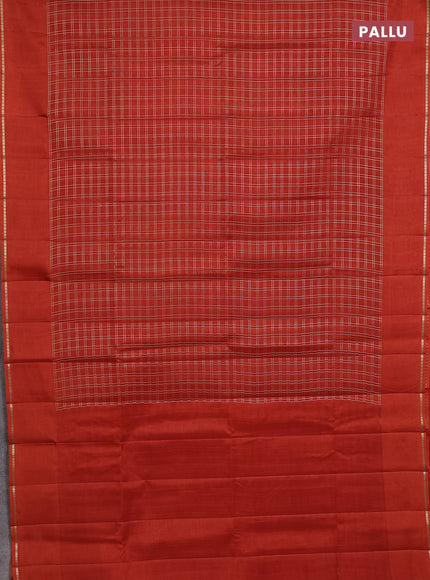 Semi tussar saree rust with allover zari checks and simple zari woven border