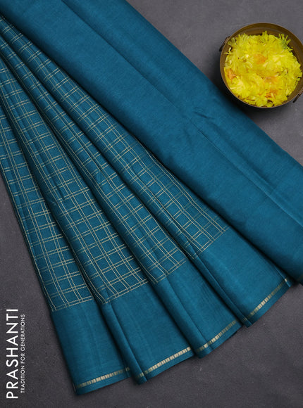 Semi tussar saree peacock green with allover zari checks and simple zari woven border