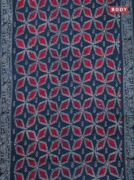 Sungudi cotton saree peacock green and pink with allover batik prints and printed border