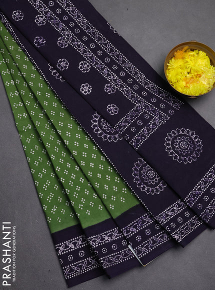Sungudi cotton saree sap green with allover batik prints and printed border