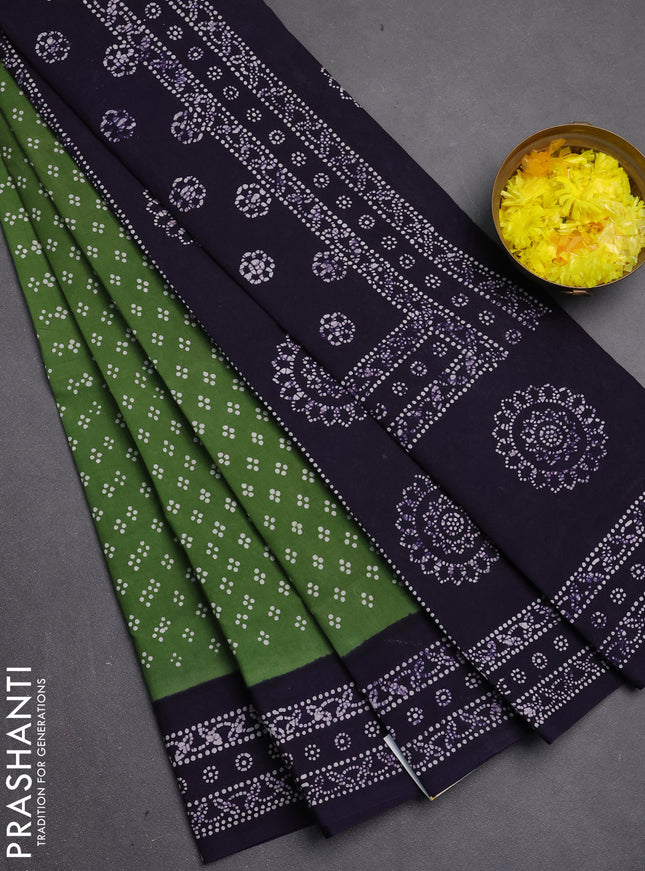 Sungudi cotton saree sap green with allover batik prints and printed border