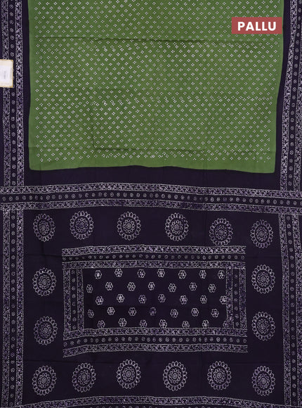 Sungudi cotton saree sap green with allover batik prints and printed border