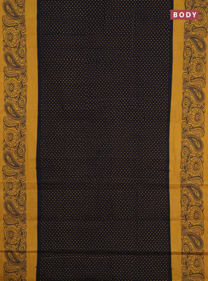 Sungudi cotton saree black and mustard yellow with allover polka dot prints and printed border