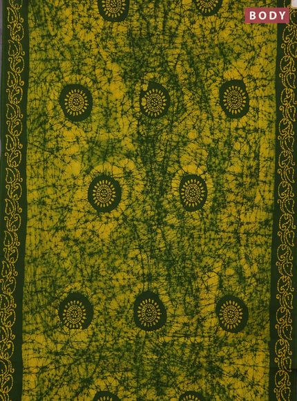 Sungudi cotton saree yellow and green with allover batik prints and printed border