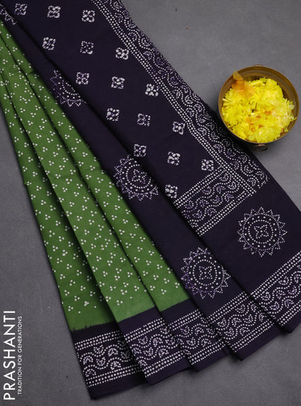 Sungudi cotton saree green and violet with allover batik butta prints and printed border