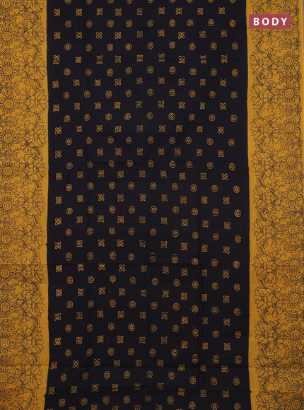 Sungudi cotton saree black and mustard yellow with allover batik butta prints and printed border