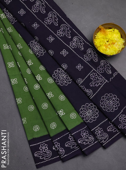 Sungudi cotton saree green and violet with allover batik butta prints and printed border