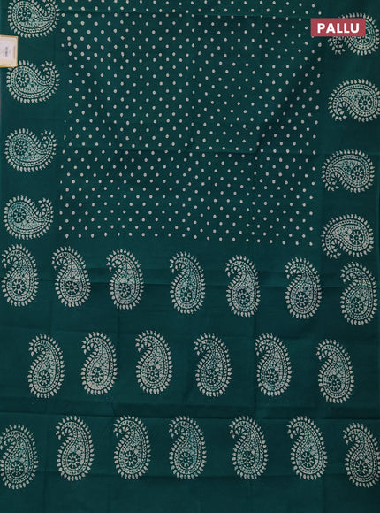 Sungudi cotton saree teal green with allover polka dot prints and paisley printed border