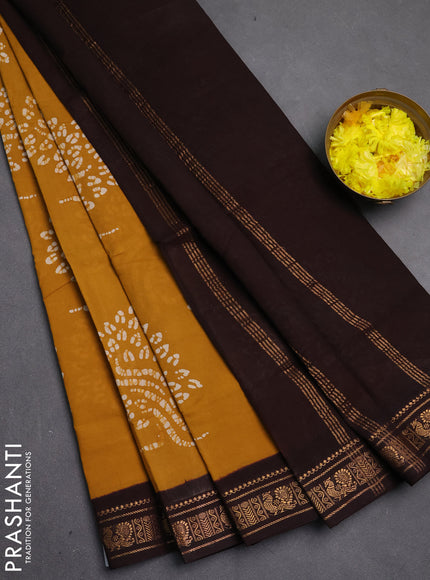 Sungudi cotton saree mustard yellow and coffee brown with allover batik butta prints and zari woven border