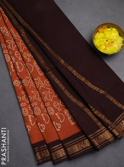 Sungudi cotton saree brown and coffee brown with allover batik prints and zari woven border