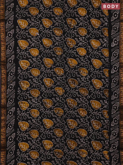 Sungudi cotton saree black with allover batik prints and zari woven printed border