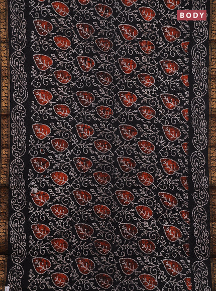 Sungudi cotton saree black with allover batik prints and zari woven printed border