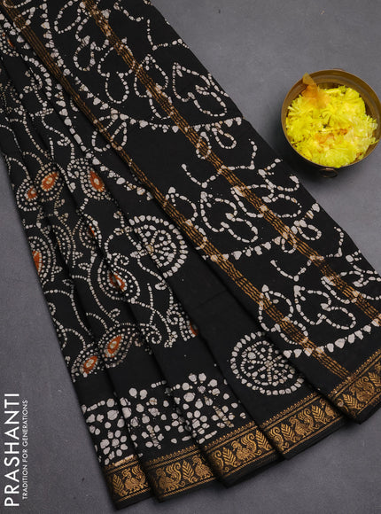 Sungudi cotton saree black with allover batik prints and zari woven printed border