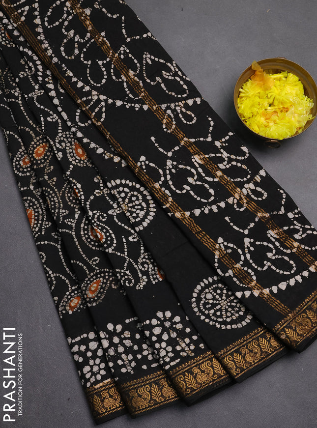 Sungudi cotton saree black with allover batik prints and zari woven printed border