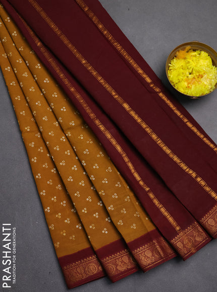 Sungudi cotton saree dark mustard yellow and maroon with allover batik butta prints and zari woven border