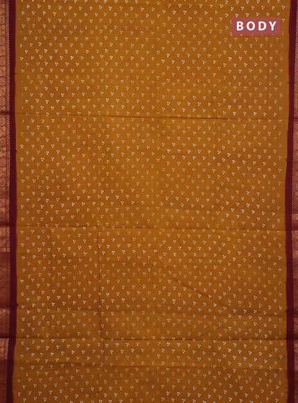 Sungudi cotton saree dark mustard yellow and maroon with allover batik butta prints and zari woven border