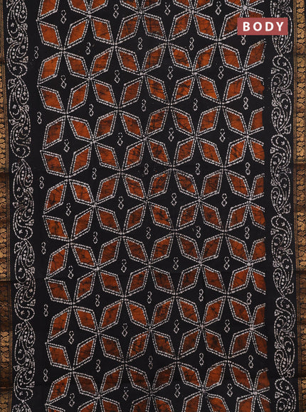 Sungudi cotton saree black with allover batik geometric prints and zari woven printed border