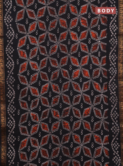 Sungudi cotton saree black with allover batik geometric prints and zari woven printed border