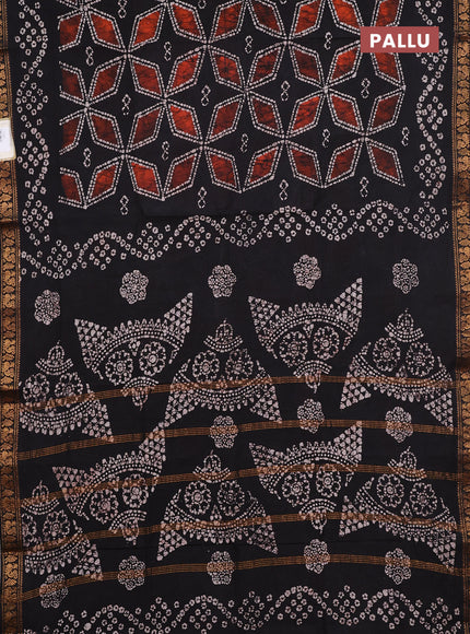 Sungudi cotton saree black with allover batik geometric prints and zari woven printed border