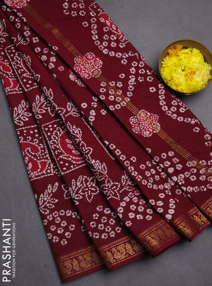 Sungudi cotton saree wine with allover batik prints and zari woven border