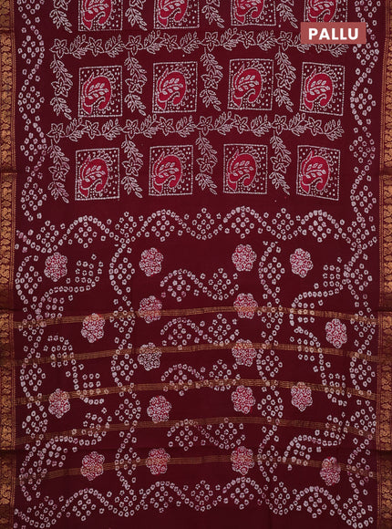 Sungudi cotton saree wine with allover batik prints and zari woven border