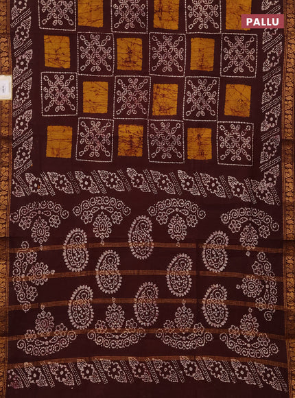 Sungudi cotton saree deep brown with allover batik prints and zari woven printed border