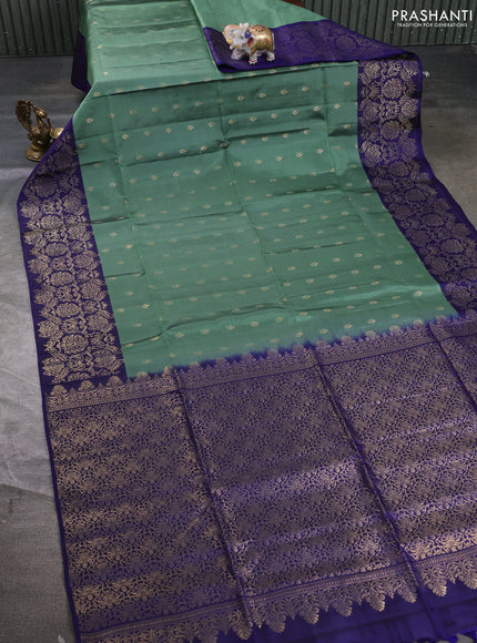 Kanchipuram soft silk saree pastel green and navy blue with allover zari woven buttas and zari woven border