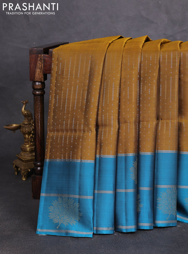Kanchipuram soft silk saree mustard green and peacock blue with allover silver & gold zari weaves and long zari woven butta border