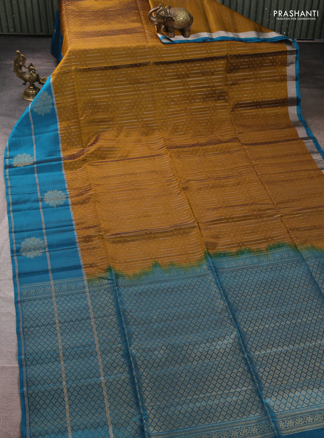 Kanchipuram soft silk saree mustard green and peacock blue with allover silver & gold zari weaves and long zari woven butta border