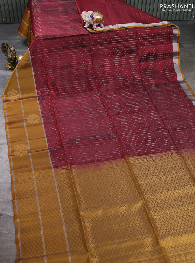 Kanchipuram soft silk saree deep maroon and dark mustard with allover silver & gold zari weaves and long zari woven butta border