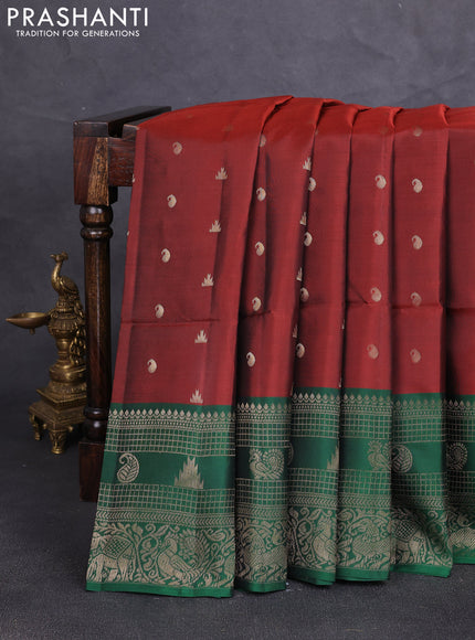 Kanchipuram soft silk saree rust shade and green with allover zari woven buttas and long zari woven border