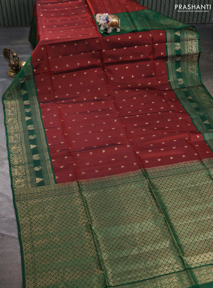 Kanchipuram soft silk saree rust shade and green with allover zari woven buttas and long zari woven border