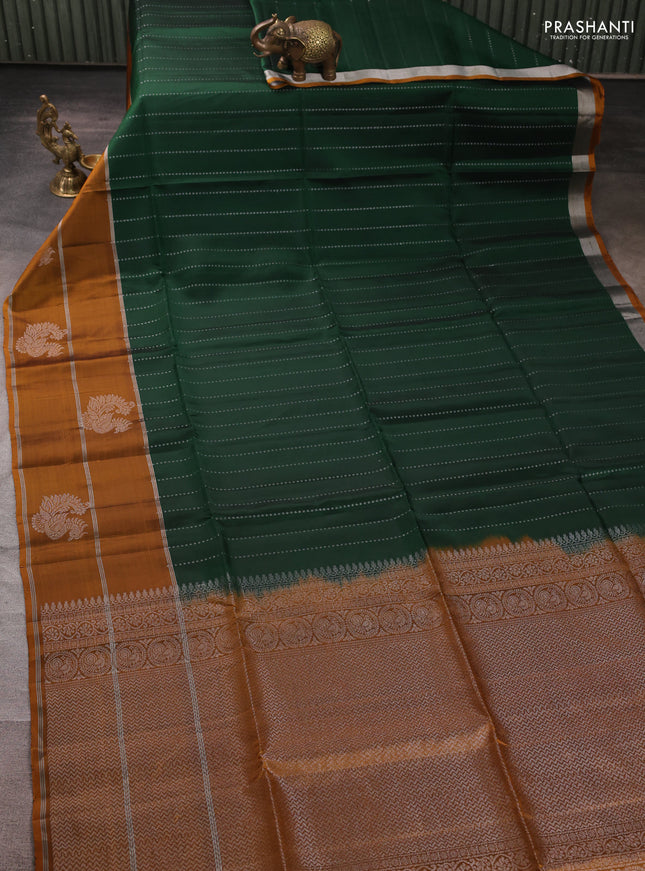 Kanchipuram soft silk saree bottle green and mustard yellow with allover silver zari weaves and long zari woven butta border