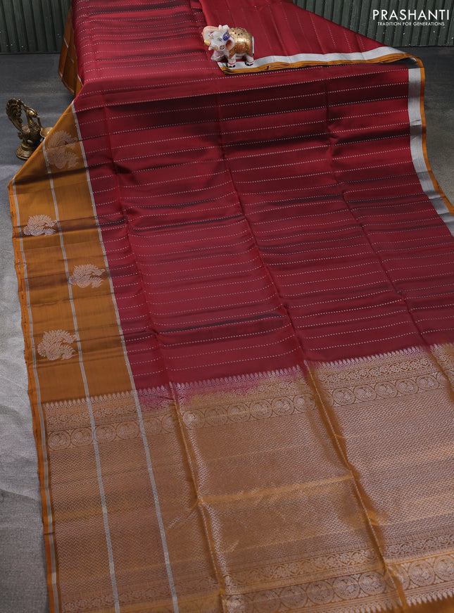 Kanchipuram soft silk saree maroon and mustard yellow with allover silver zari weaves and long zari woven butta border