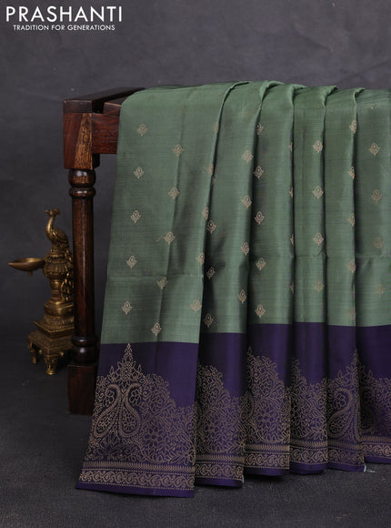 Kanchipuram soft silk saree pastel green and navy blue with allover zari woven buttas and long zari woven border