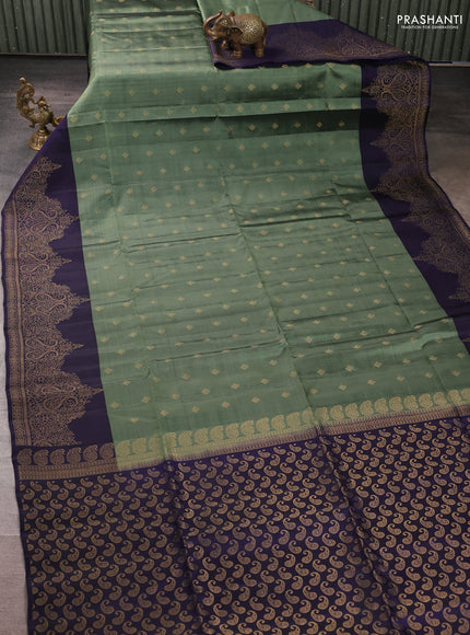 Kanchipuram soft silk saree pastel green and navy blue with allover zari woven buttas and long zari woven border