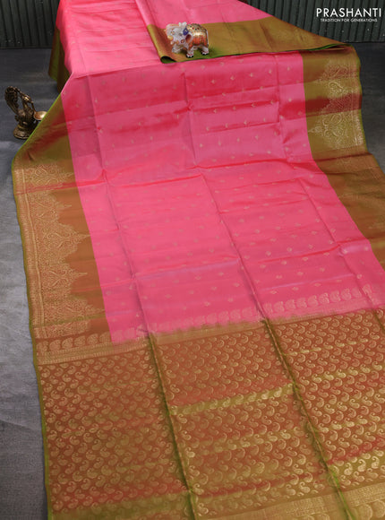 Kanchipuram soft silk saree peach pink and light green with allover zari woven buttas and zari wovenn border