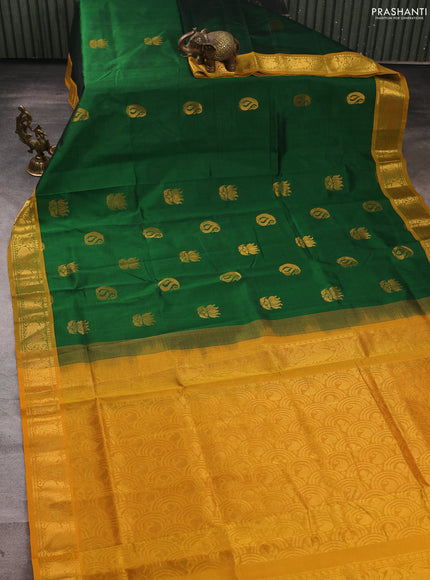 Silk cotton saree green and mustard yellow with zari woven buttas and zari woven annam border