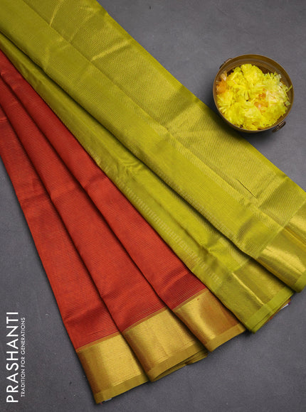 Silk cotton saree rust shdae and light green with allover vairosi pattern and zari woven border