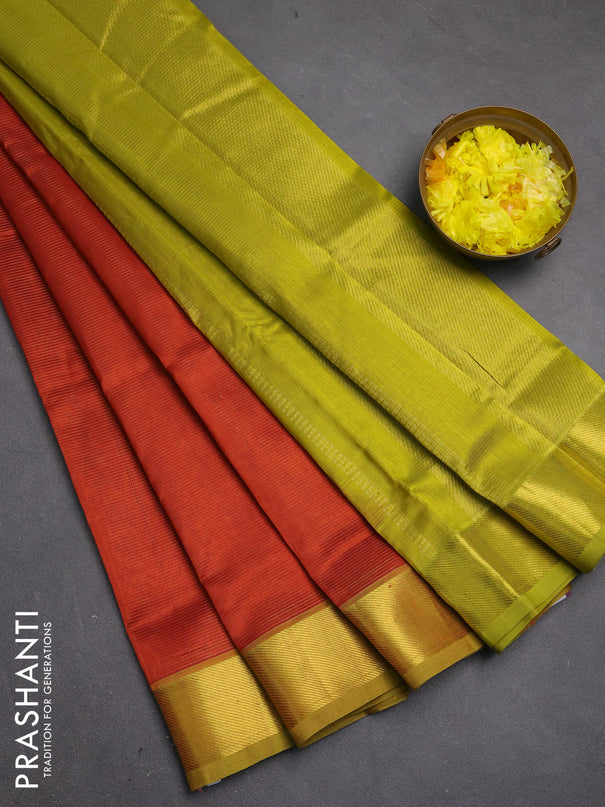 Silk cotton saree rust shdae and light green with allover vairosi pattern and zari woven border