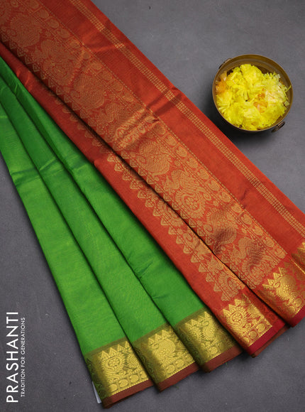 Silk cotton saree green and rustic orange with allover vairosi pattern and zari woven border