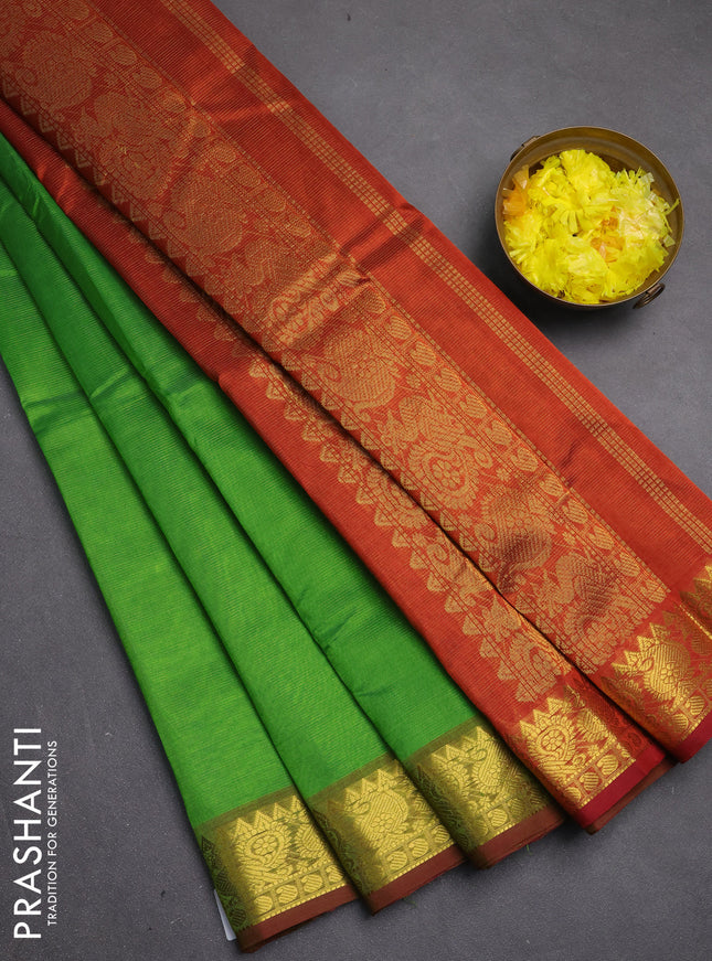 Silk cotton saree green and rustic orange with allover vairosi pattern and zari woven border