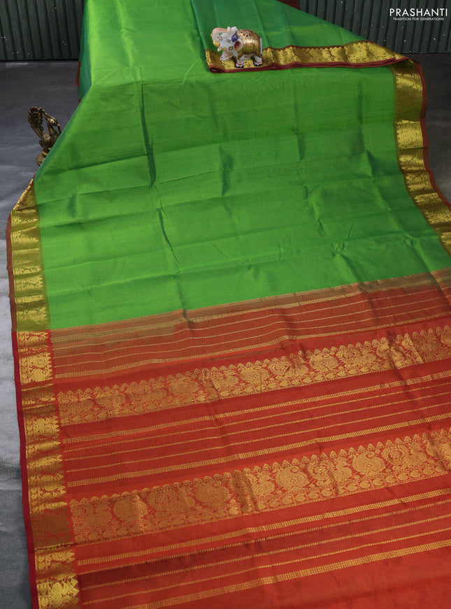 Silk cotton saree green and rustic orange with allover vairosi pattern and zari woven border