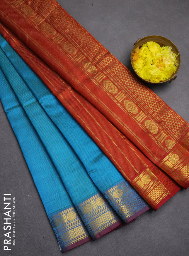 Silk cotton saree teal blue and rustic orange with allover vairosi pattern and zari woven border